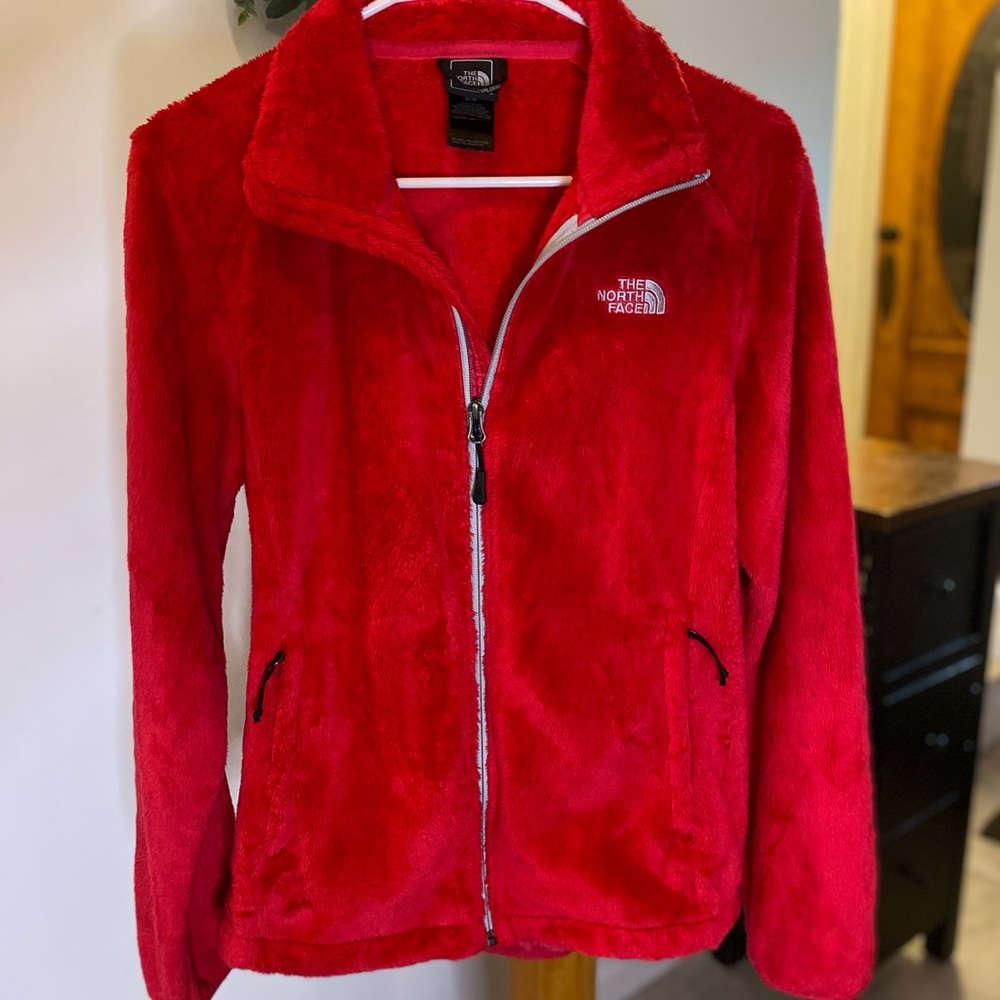 North face women’s medium fleece zip up, a dark pink almost red.